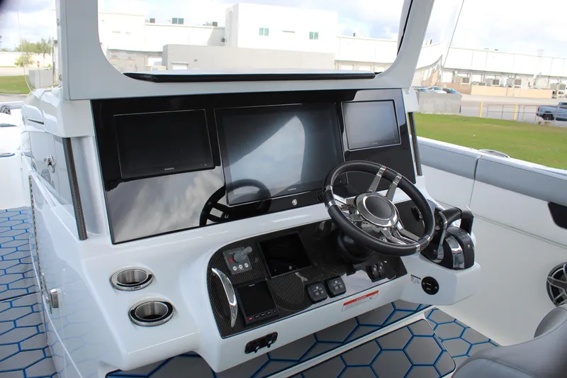  Yacht Photos Pics 2020 Mystic Powerboats M4200 helm with modern controls and sleek design.