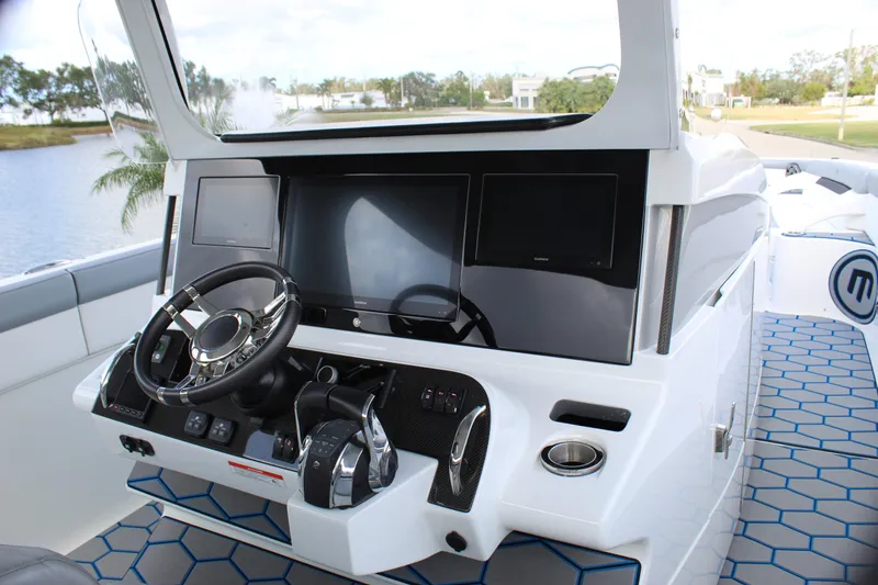  Yacht Photos Pics 2020 Mystic Powerboats M4200 helm with modern controls and sleek design.