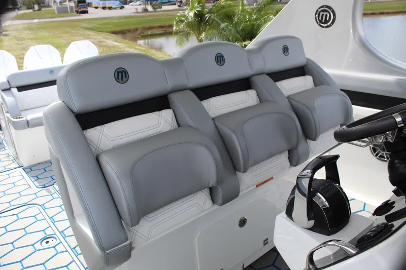  Yacht Photos Pics 2020 Mystic Powerboats M4200 interior with luxurious gray seating and modern design.