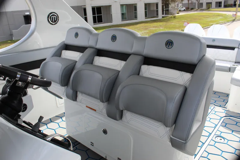  Yacht Photos Pics 2020 Mystic Powerboats M4200 interior with luxurious gray seating and modern design.
