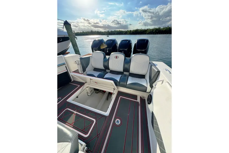  Yacht Photos Pics 2017 Cigarette 39' GTS boat interior with seating and open storage compartment.