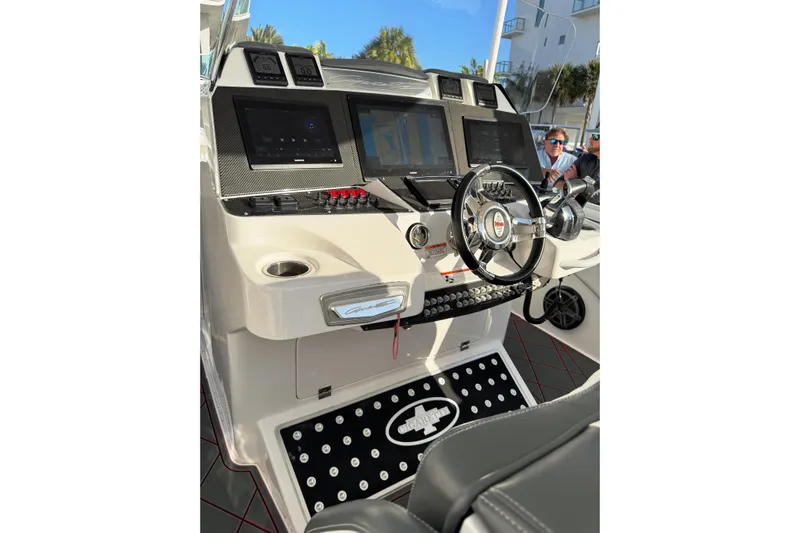  Yacht Photos Pics 2017 Cigarette 39' GTS boat dashboard with modern controls and steering wheel.