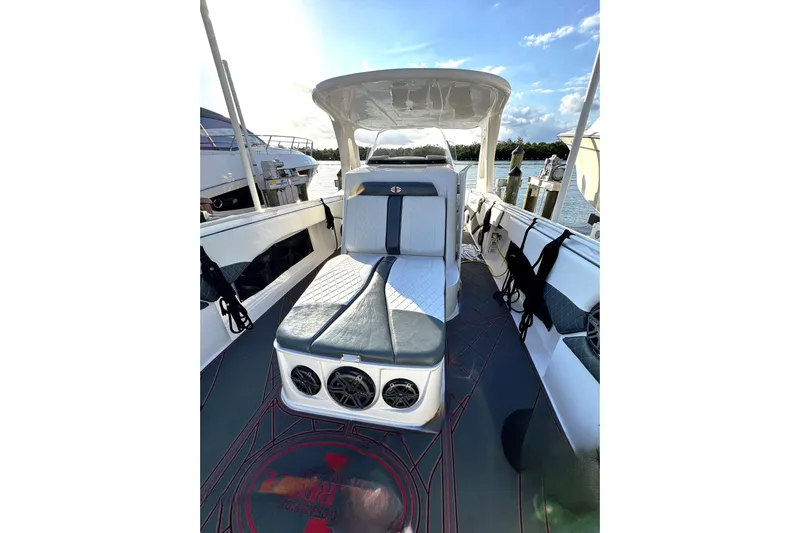  Yacht Photos Pics 2017 Cigarette 39' GTS boat interior with seating and speakers, docked by the water.