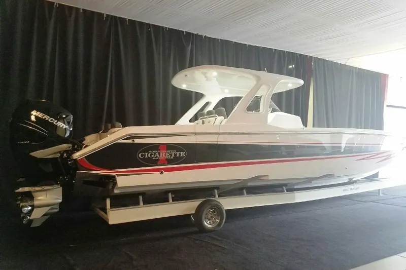  Yacht Photos Pics 2017 Cigarette 39' GTS boat with Mercury engines on display indoors.