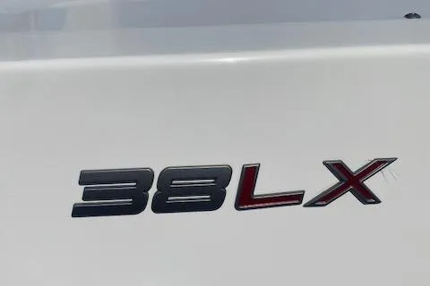 Knot Sorry Yacht Photos Pics Tiara Yachts 2021 38LX model logo on white surface.