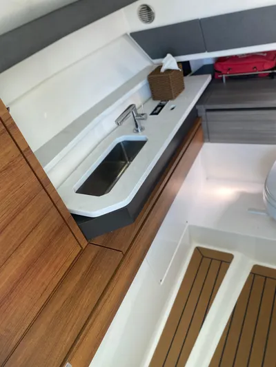 Knot Sorry Yacht Photos Pics Interior of 2021 Tiara Yachts 38LX, featuring a sleek sink and modern cabinetry.