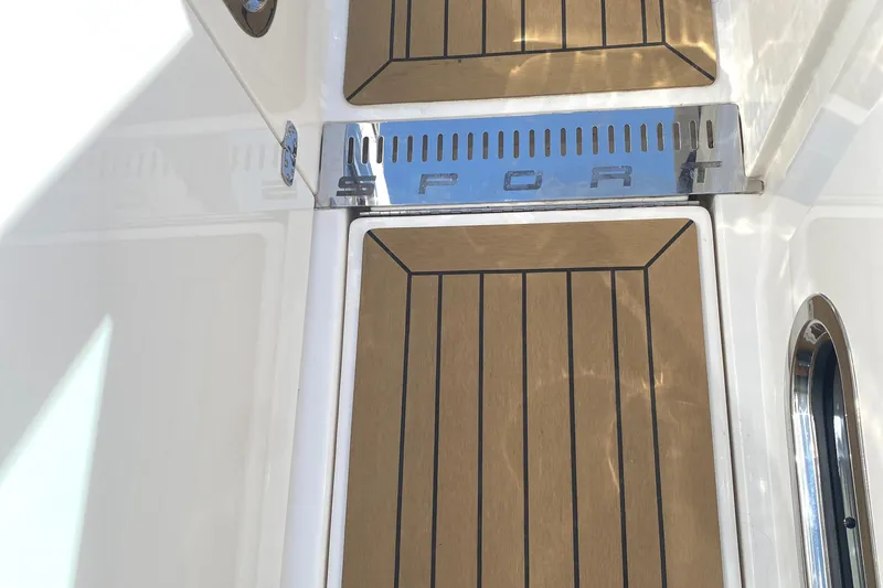 Knot Sorry Yacht Photos Pics Teak deck of 2021 Tiara Yachts 38LX with "SPORT" metal detail.