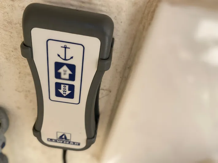 Knot Sorry Yacht Photos Pics Anchor control panel on 2021 Tiara Yachts 38LX, featuring up and down buttons.