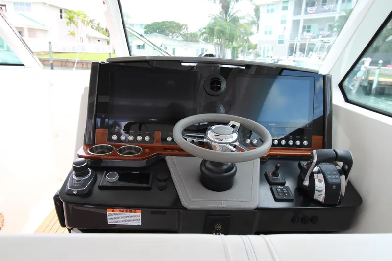 Knot Sorry Yacht Photos Pics 2021 Tiara Yachts 38LX helm with modern controls and dual screens.