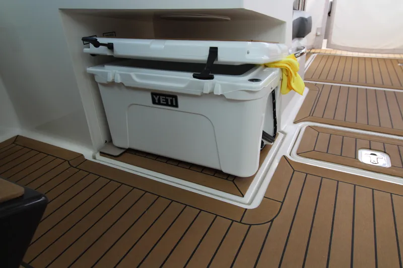 Knot Sorry Yacht Photos Pics 2021 Tiara Yachts 38LX with Yeti cooler on teak-style deck.