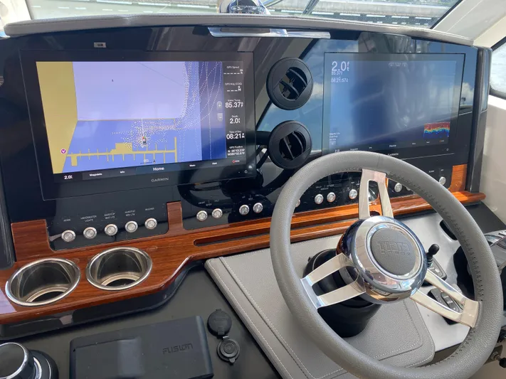 Knot Sorry Yacht Photos Pics Helm of 2021 Tiara Yachts 38LX with advanced navigation displays and controls.
