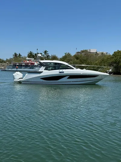  Yacht Photos Pics 2024 Beneteau Gran Turismo 36 yacht cruising on a sunny day.