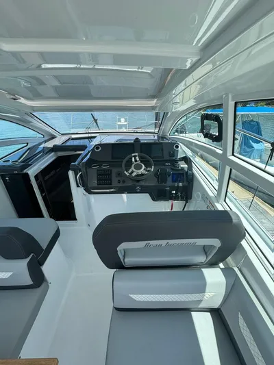  Yacht Photos Pics 2024 Beneteau Gran Turismo 36 cockpit with modern steering and seating.