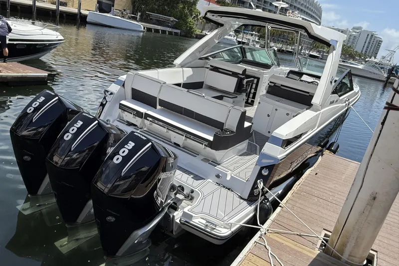  Yacht Photos Pics 2023 Monterey 385 Super Sport boat docked with triple 300 horsepower engines.