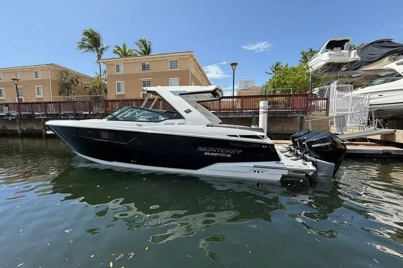  Yacht Photos Pics 2023 Monterey 385 Super Sport boat docked in sunny marina setting.