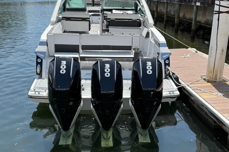  Yacht Photos Pics 2023 Monterey 385 Super Sport boat with triple 300 horsepower Mercury engines docked.