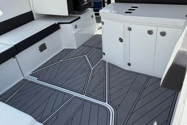  Yacht Photos Pics 2023 Monterey 385 Super Sport boat interior with sleek seating and modern flooring design.