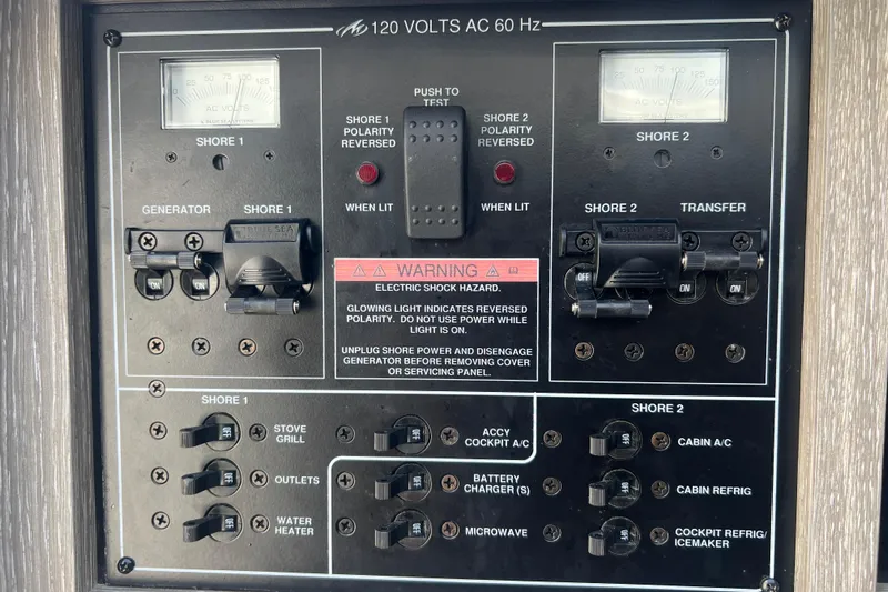  Yacht Photos Pics 2023 Monterey 385 Super Sport electrical panel with shore power and generator controls.