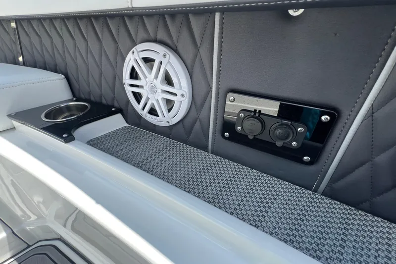  Yacht Photos Pics 2023 Monterey 385 Super Sport interior with speaker, cup holder, and power outlets.