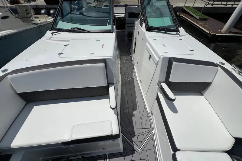  Yacht Photos Pics 2023 Monterey 385 Super Sport boat interior with sleek seating and modern design.