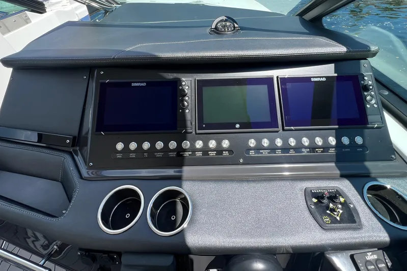  Yacht Photos Pics 2023 Monterey 385 Super Sport dashboard with Simrad displays and control panel.