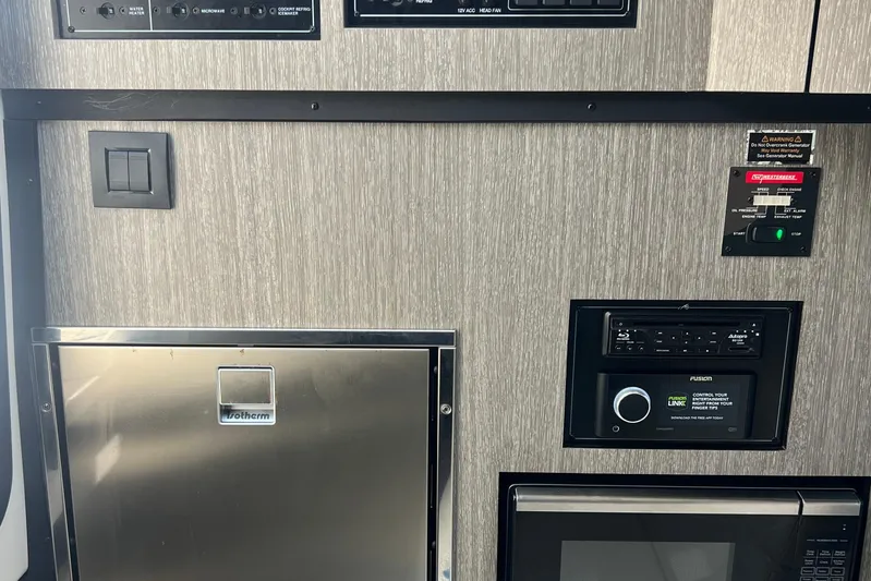  Yacht Photos Pics Control panel and appliances inside a 2023 Monterey 385 Super Sport boat.