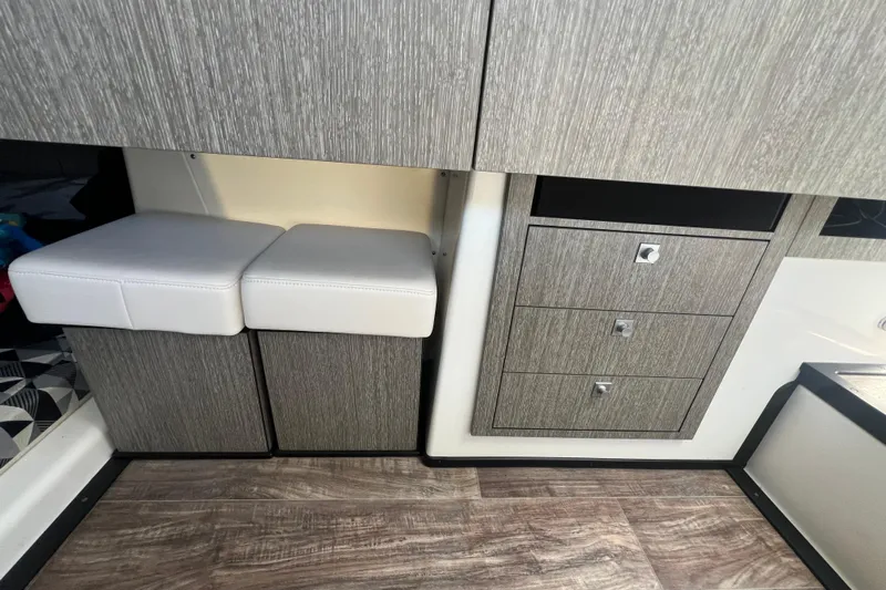  Yacht Photos Pics Interior of 2023 Monterey 385 Super Sport with modern cabinetry and seating.