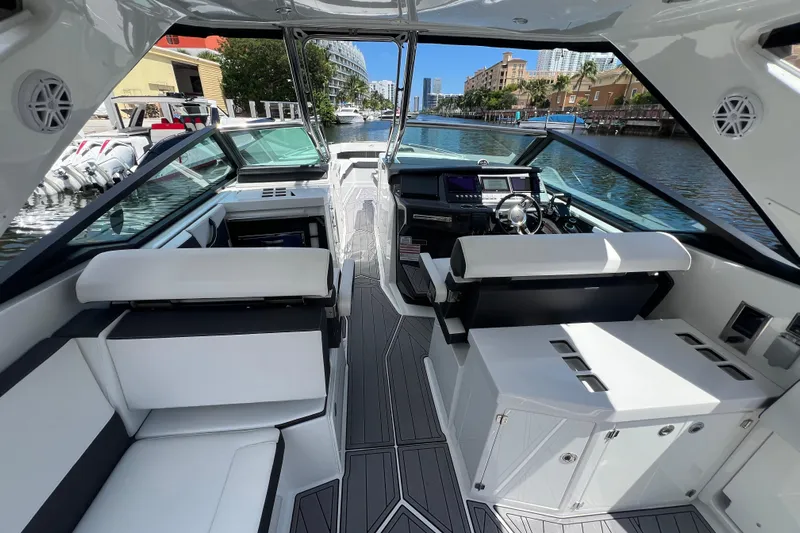  Yacht Photos Pics 2023 Monterey 385 Super Sport boat interior with sleek seating and modern dashboard.