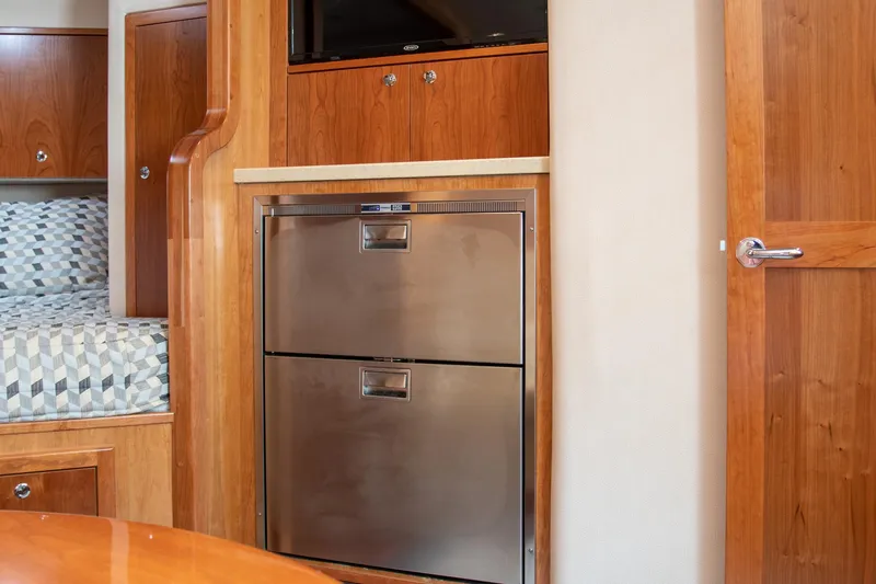 Salty Bear Yacht Photos Pics Interior of 2022 Albemarle 360 Express Fisherman with wood cabinetry and stainless steel appliances.