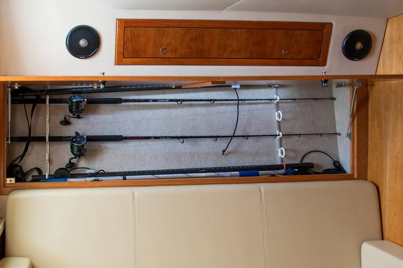 Salty Bear Yacht Photos Pics Storage compartment with fishing rods in a 2022 Albemarle 360 Express Fisherman boat.