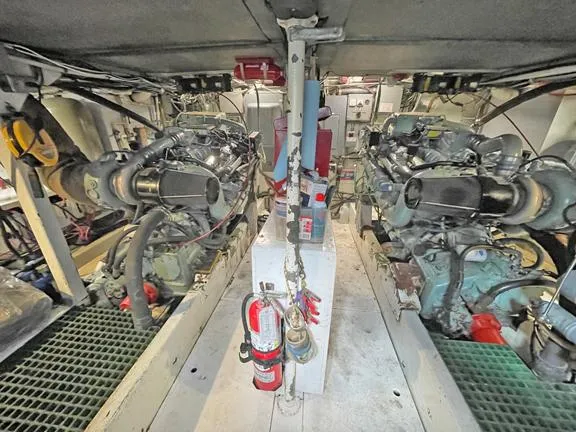 Truth Yacht Photos Pics Engine room of 1974 Custom Expedition Liveaboard with dual engines and safety equipment.
