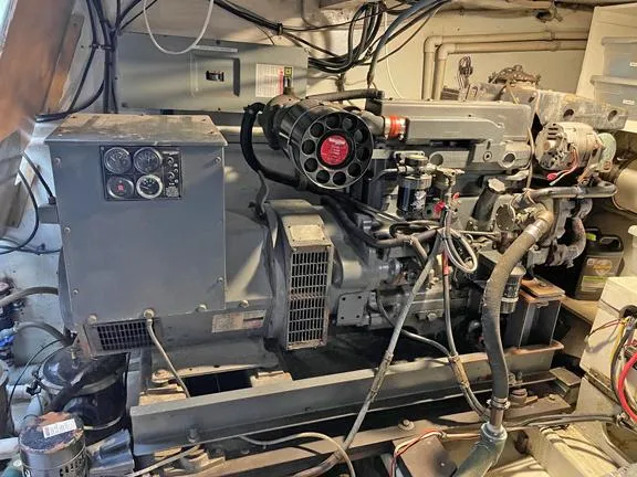 Truth Yacht Photos Pics Engine room of a 1974 Custom Expedition Liveaboard with visible machinery and wiring.