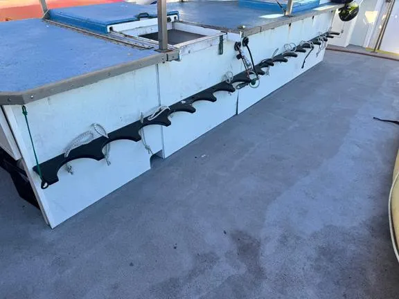 Truth Yacht Photos Pics 1974 Custom Expedition Liveaboard deck with fishing rod holders and storage compartments.