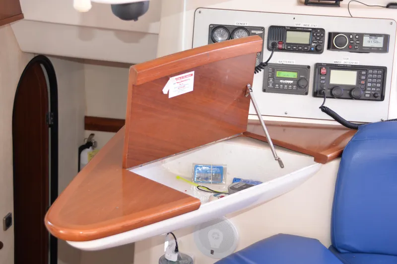 Dreamweaver Yacht Photos Pics Navigation station on 2004 Fountaine Pajot Belize 43 catamaran with radio equipment and storage.