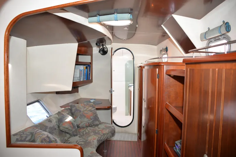 Dreamweaver Yacht Photos Pics Interior of 2004 Fountaine Pajot Belize 43 catamaran with cozy seating and wooden cabinetry.