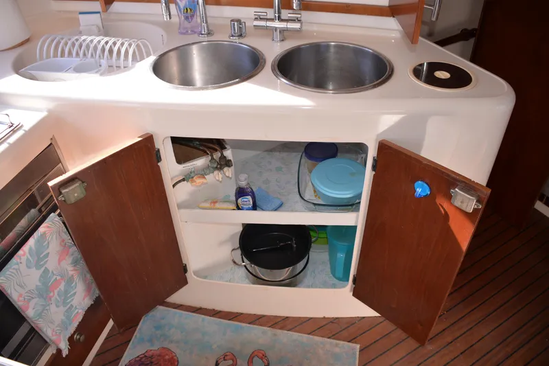 Dreamweaver Yacht Photos Pics 2004 Fountaine Pajot Belize 43 kitchen with open cabinets and dual sinks.