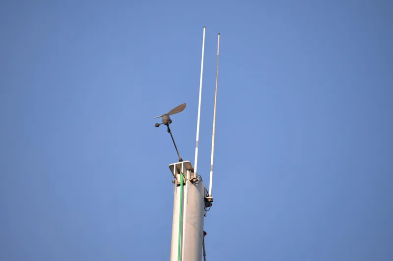 Dreamweaver Yacht Photos Pics Sailboat mast with antennas against clear blue sky, Fountaine Pajot Belize 43, 2004 model.