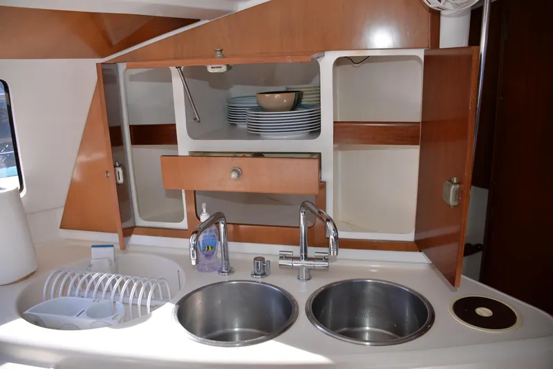 Dreamweaver Yacht Photos Pics 2004 Fountaine Pajot Belize 43 yacht kitchen with double sink and open cabinets.
