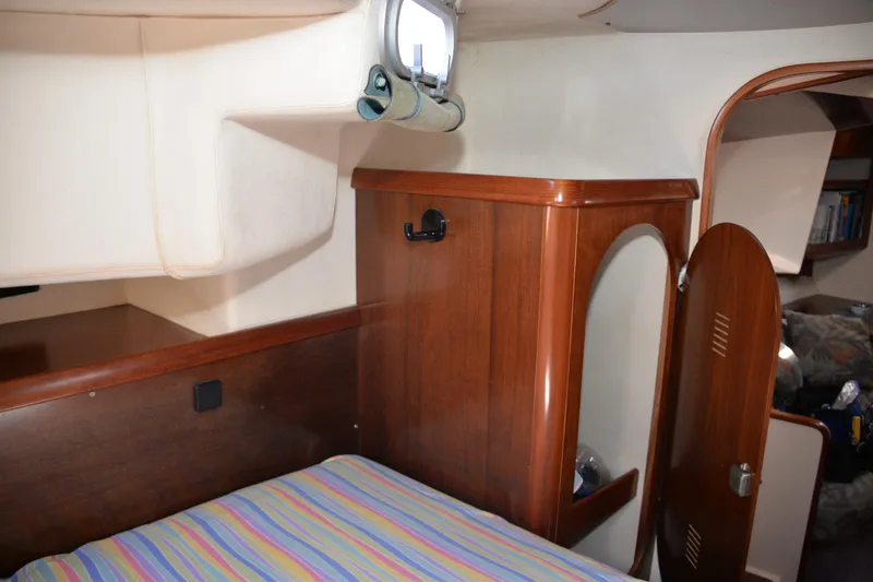 Dreamweaver Yacht Photos Pics Interior cabin of 2004 Fountaine Pajot Belize 43 catamaran with wooden furnishings.