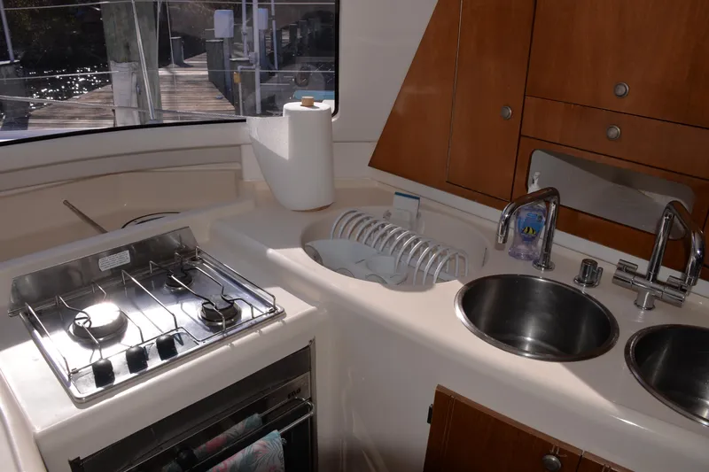 Dreamweaver Yacht Photos Pics Interior kitchen of 2004 Fountaine Pajot Belize 43 catamaran with stove and sink.