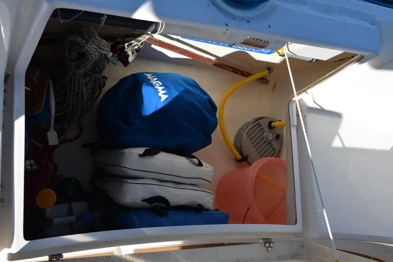 Dreamweaver Yacht Photos Pics Storage compartment on 2004 Fountaine Pajot Belize 43 with boating equipment and supplies.