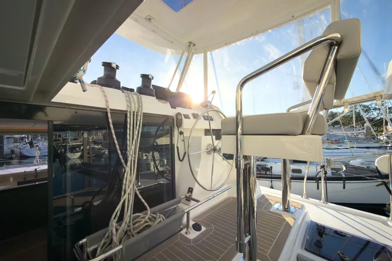 Panthera Yacht Photos Pics Helm station of 2021 Leopard 42 yacht with steering wheel and seating.