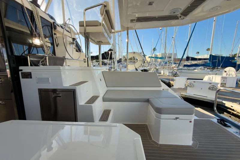 Panthera Yacht Photos Pics Luxurious 2021 Leopard 42 yacht interior with seating and helm, docked at marina.