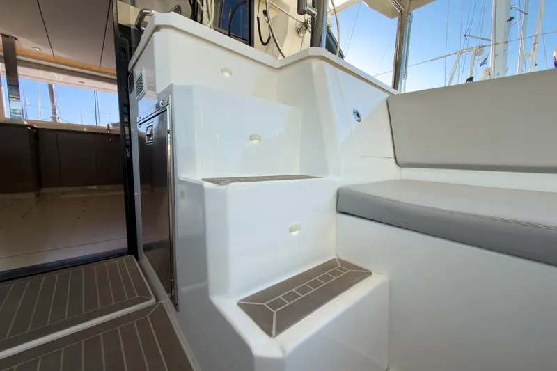 Panthera Yacht Photos Pics Interior view of 2021 Leopard 42 yacht, featuring sleek stairs and comfortable seating.