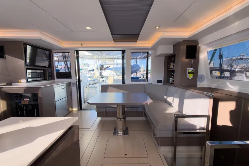 Panthera Yacht Photos Pics Luxurious interior of 2021 Leopard 42 yacht with modern kitchen and seating area.