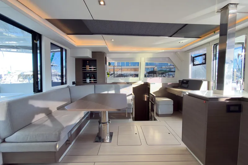 Panthera Yacht Photos Pics Luxurious interior of 2021 Leopard 42 yacht with modern seating and dining area.