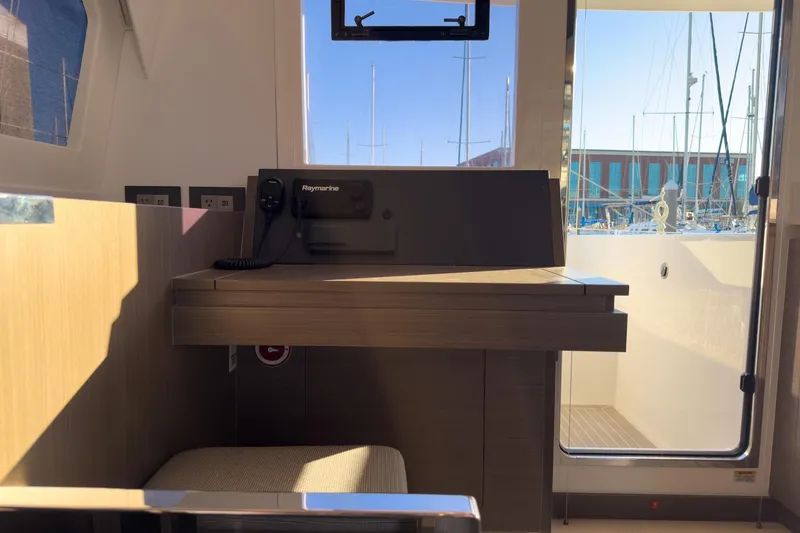 Panthera Yacht Photos Pics Interior of 2021 Leopard 42 yacht with navigation equipment and marina view.