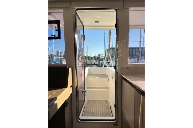 Panthera Yacht Photos Pics Interior view of 2021 Leopard 42 yacht, showcasing sleek design and marina backdrop.