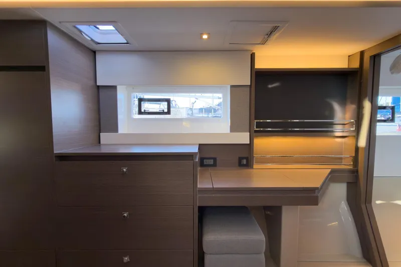 Panthera Yacht Photos Pics Modern interior of 2021 Leopard 42 yacht with sleek wood finish and ample storage.