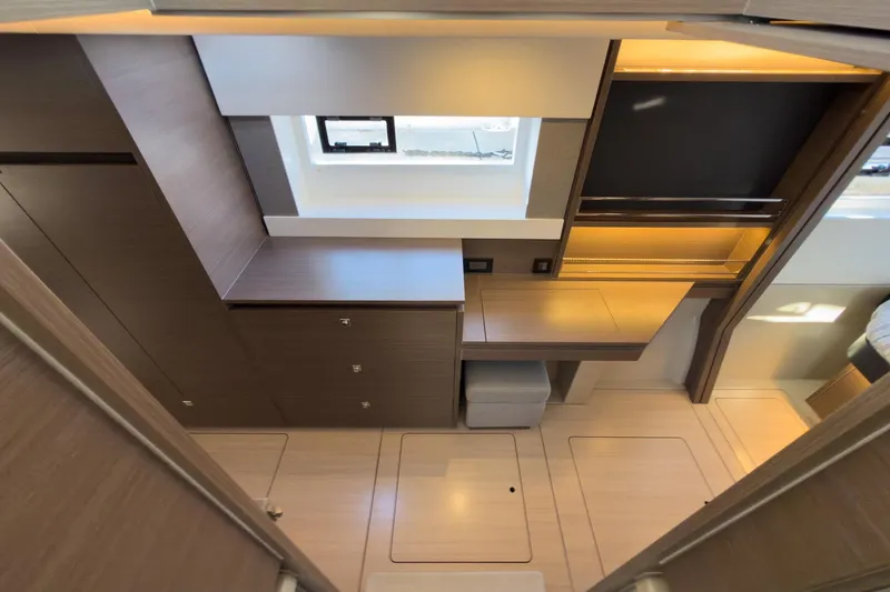 Panthera Yacht Photos Pics Modern interior of 2021 Leopard 42 yacht with sleek wood finishes and ample storage.